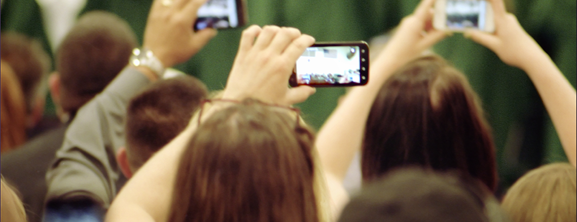 People Holding Mobile Phones